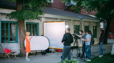 Film set, monitors and modern shooting equipment. Film crew, lighting devices, monitors, playbacks - filming equipment and a team of specialists in filming movies, advertising and TV series